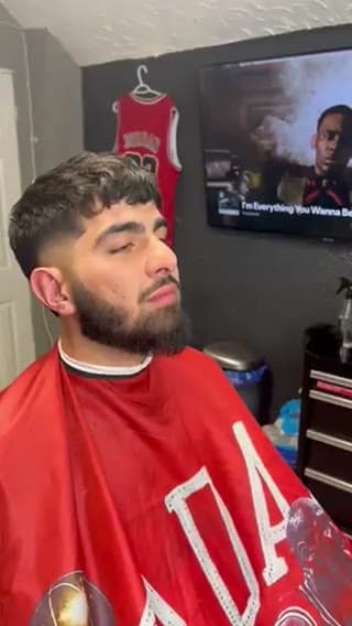 Fresh textured crop and a lined beard, front view in the chair