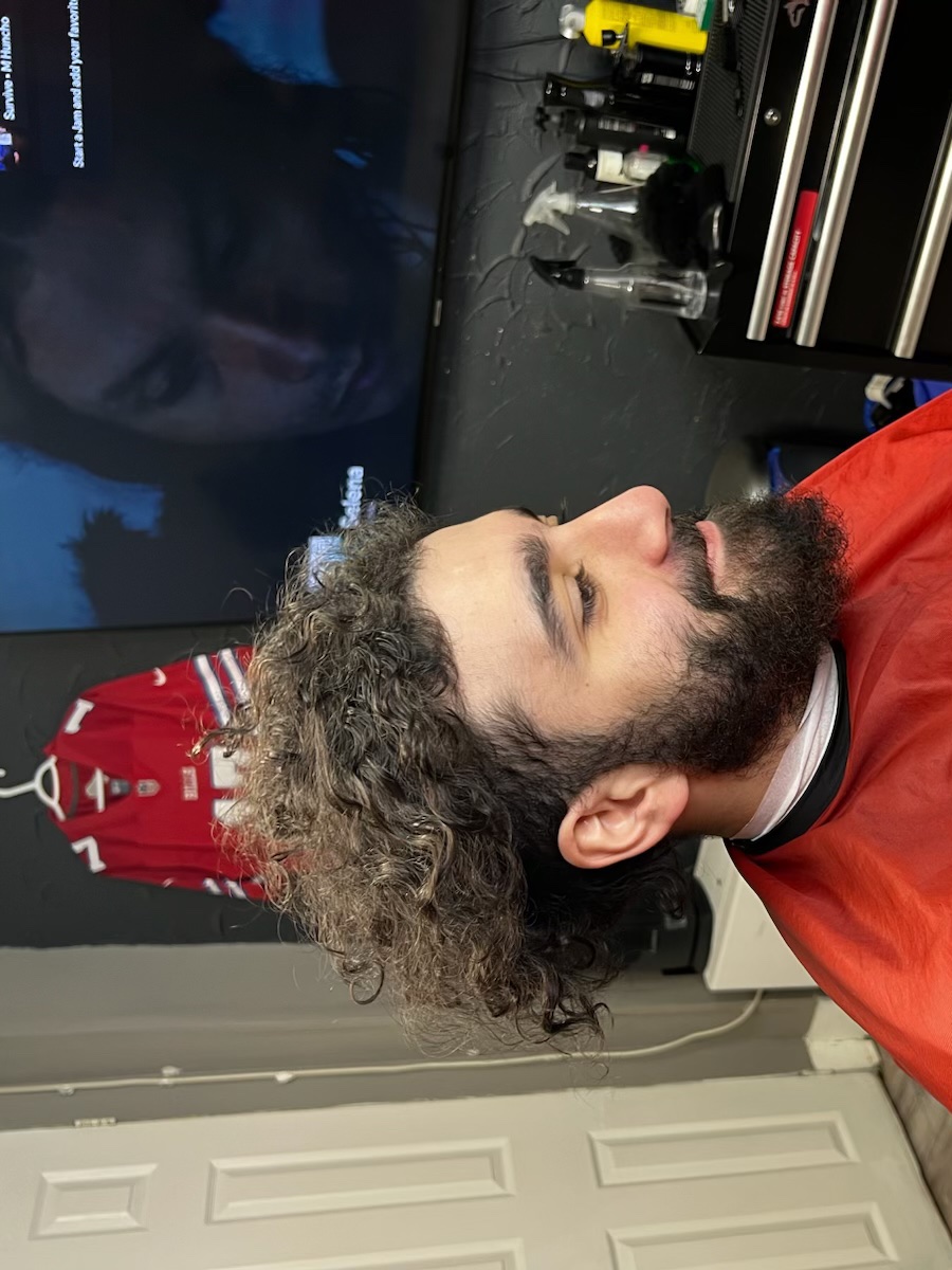 Before: long curls loose over the ears with a full untrimmed beard
